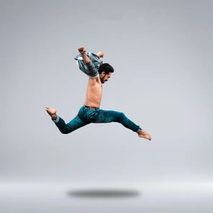 Danseur en saut haut, expression dynamique.
